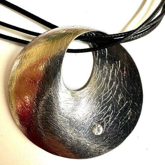 Round silver tone pendant necklace on long black cord - Picture 3 of 10